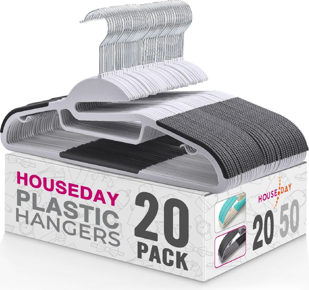 A stack of white and gray plastic hangers on top of a cardboard box.