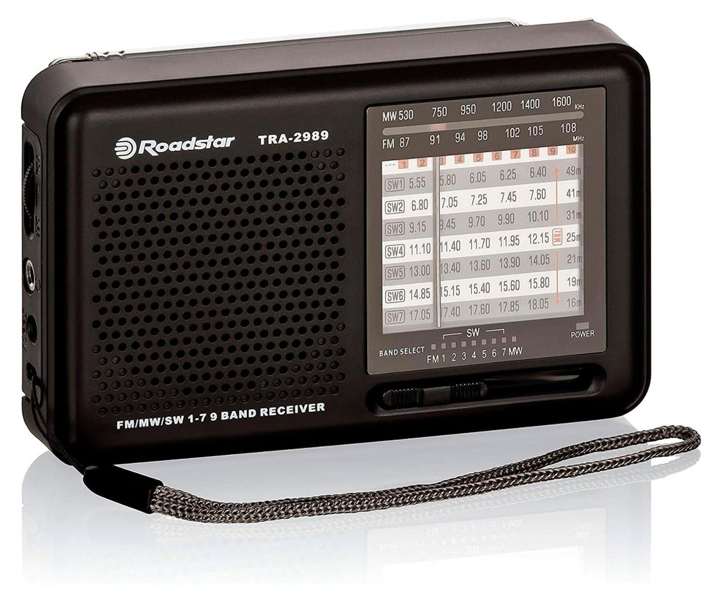 A black Roadstar TRA-2989 multiband radio is shown from a slightly elevated front-left angle against a light gray background.