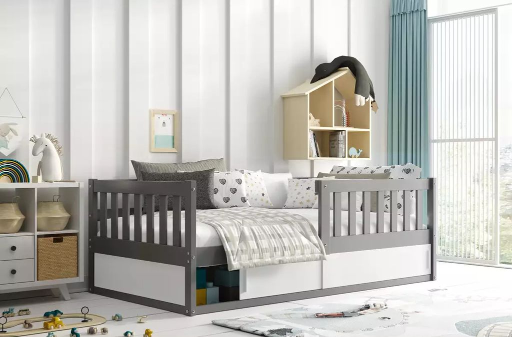 A child's bedroom with a daybed, storage shelves, and decorative items.