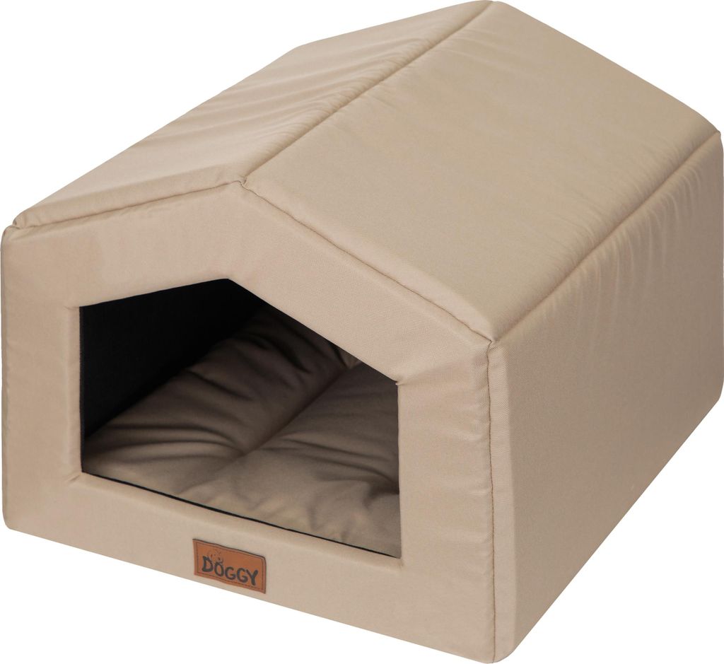 A beige dog house with a brown cushion inside, shown from a slightly elevated side angle.