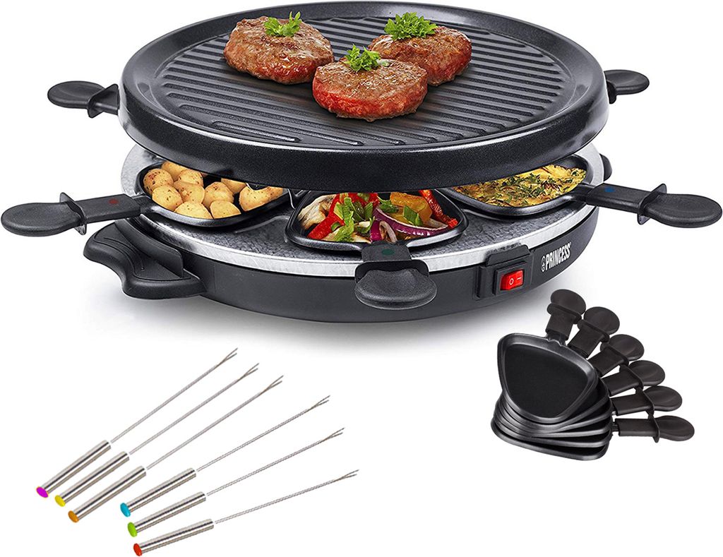 A raclette grill with food items and accessories on a white background.