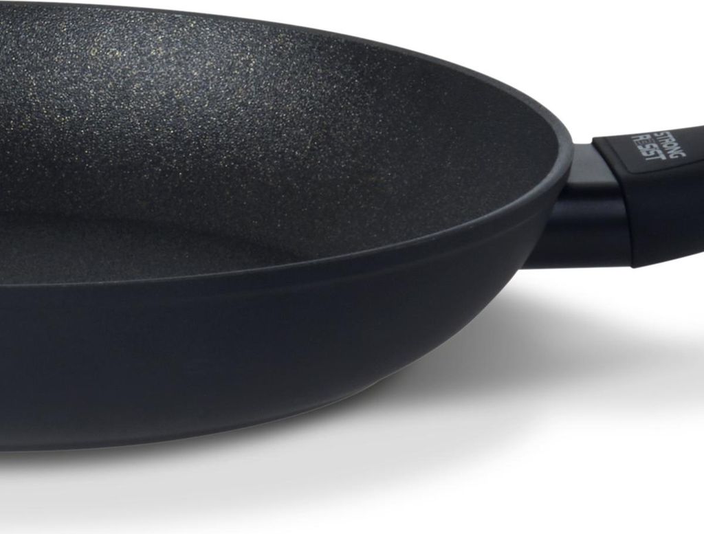 A close-up shot of a black frying pan.