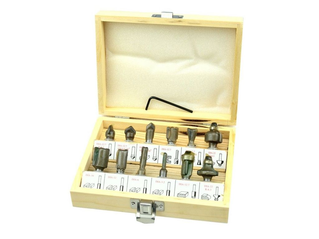 A set of router bits in a wooden box.