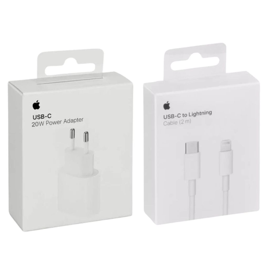 Two white product boxes are shown side-by-side against a white background. The box on the left displays an image of a white power adapter and text indicating it is a USB-C 20W Power Adapter. The box on the right shows an image of a white USB-C to Lightning