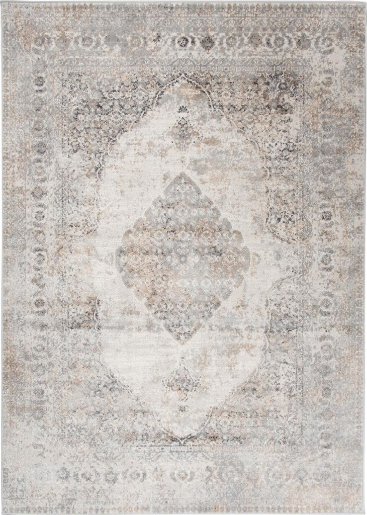 A flat lay image of a rug with a distressed, traditional pattern.