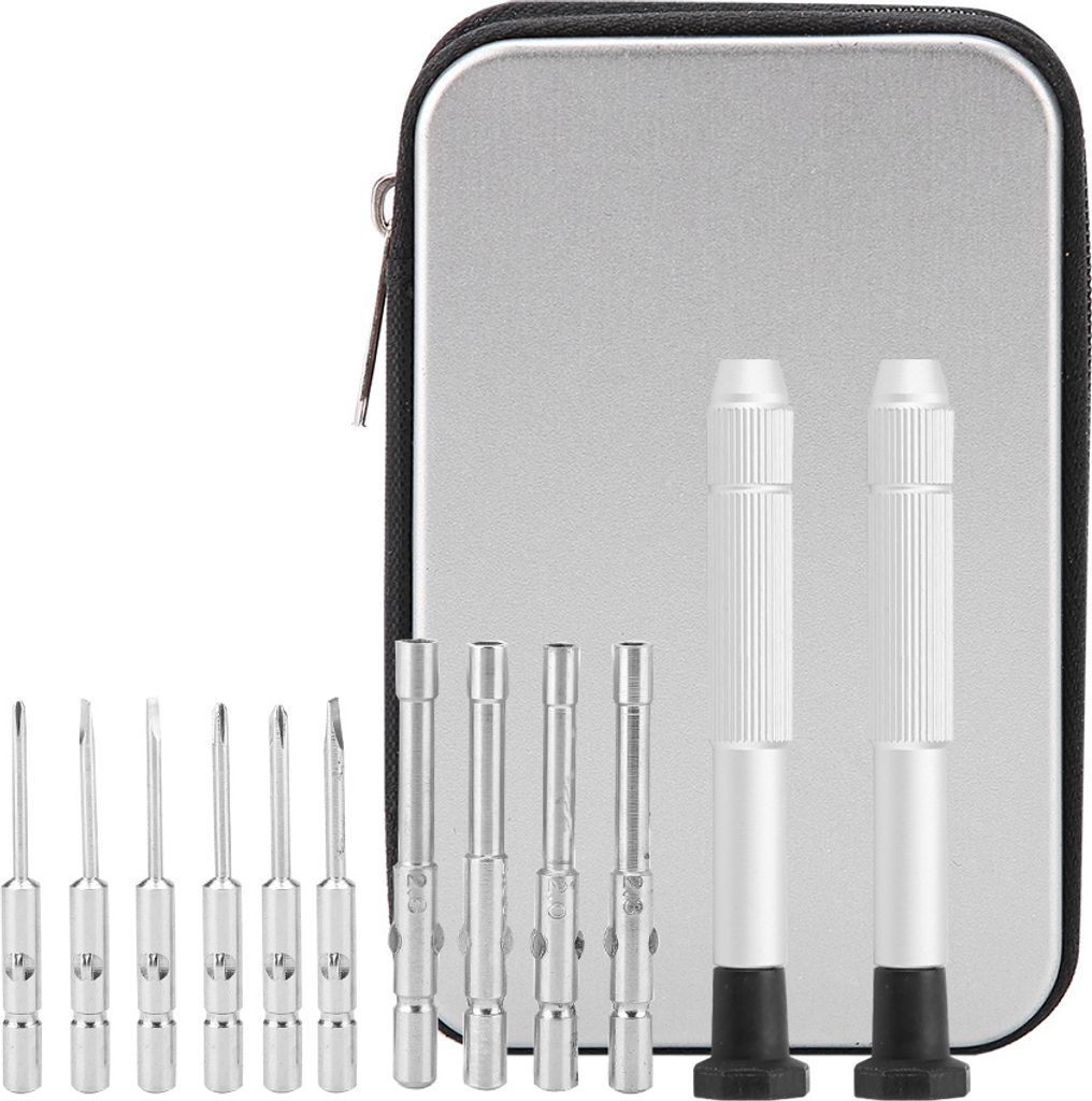 A set of precision screwdrivers and bits laid out in front of a silver carrying case.