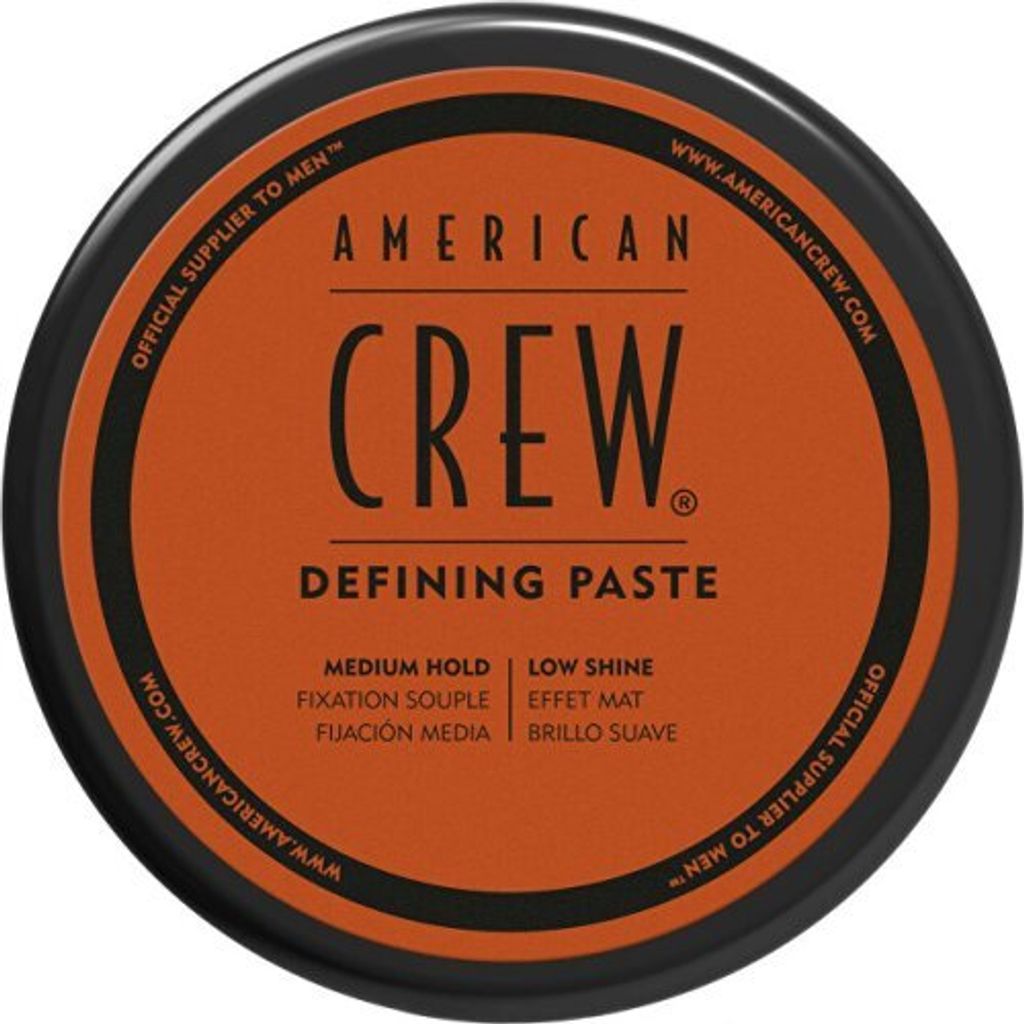 A top-down view of a round container of American Crew Defining Paste.
