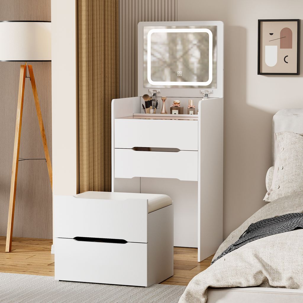 A white vanity table with a lighted mirror and a stool in a bedroom setting.