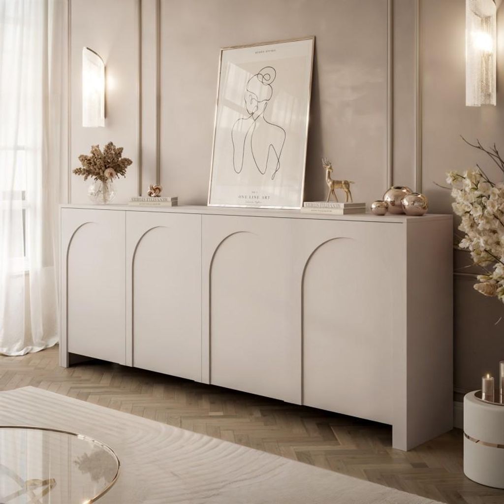 A modern living room with a light gray sideboard, artwork, and decorative items.