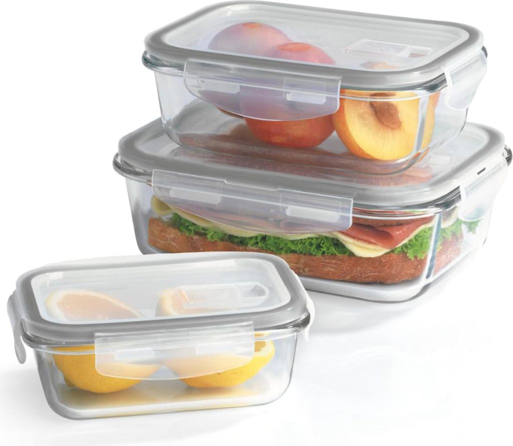 Three glass food storage containers are stacked and arranged in a studio setting against a white background.