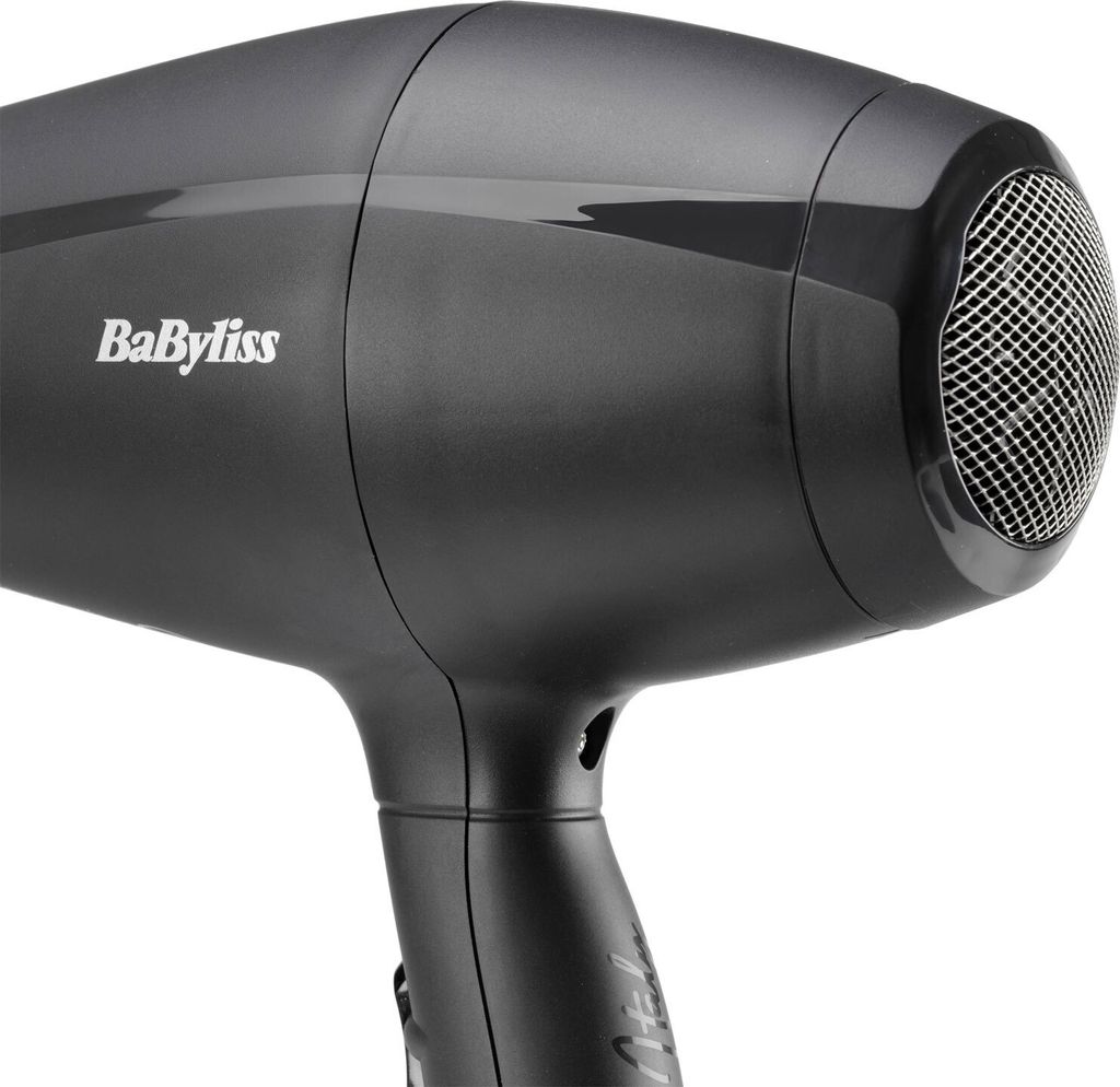 A close-up, studio shot of a black BaByliss hair dryer against a white background.