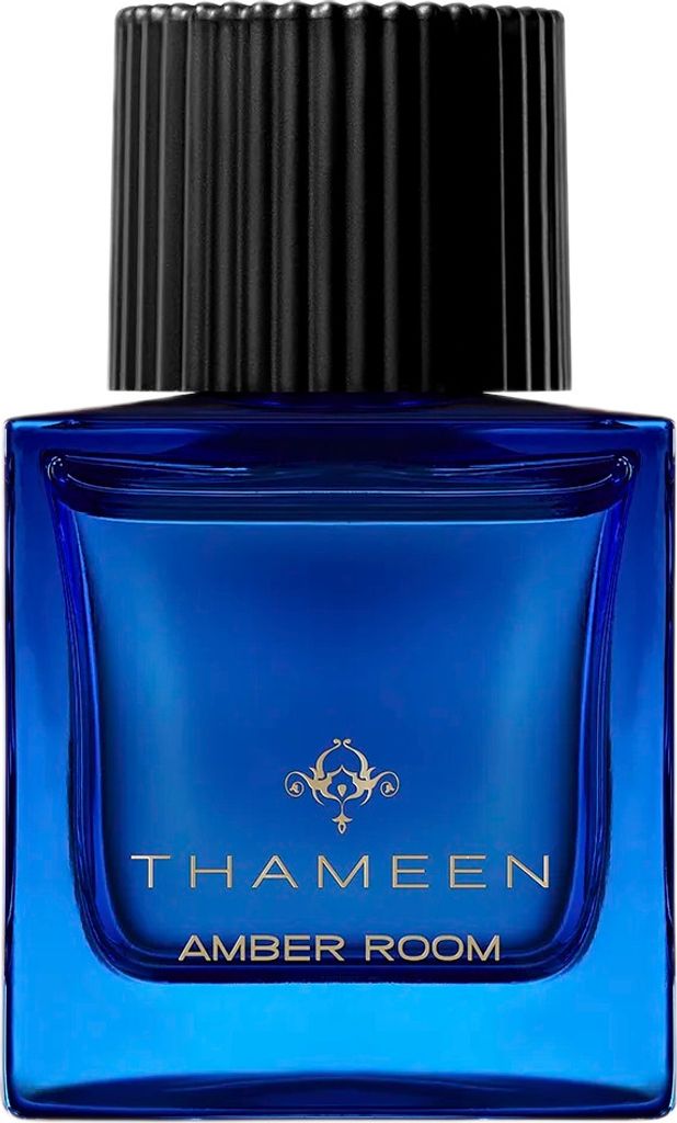 A close-up studio shot of a blue glass perfume bottle with a black ribbed cap.