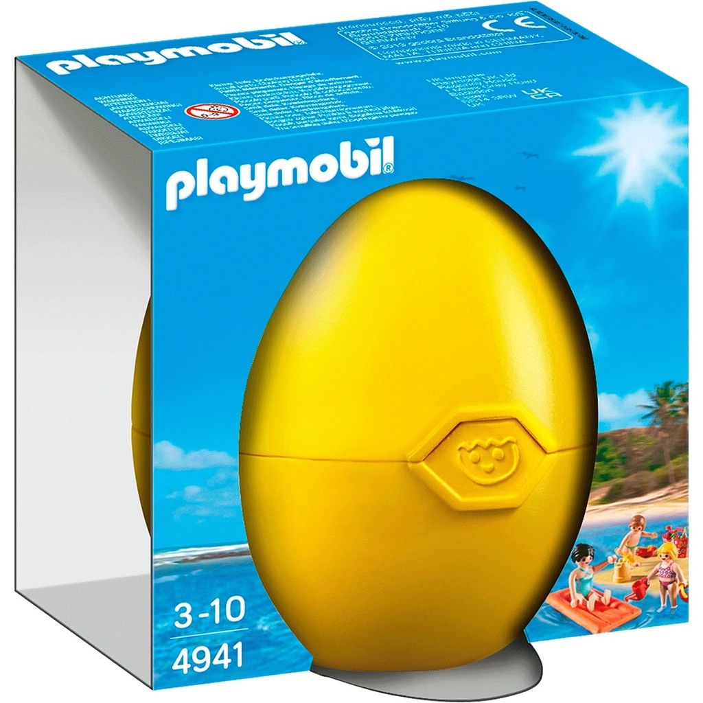 A Playmobil egg-shaped toy packaging with a beach scene illustration.
