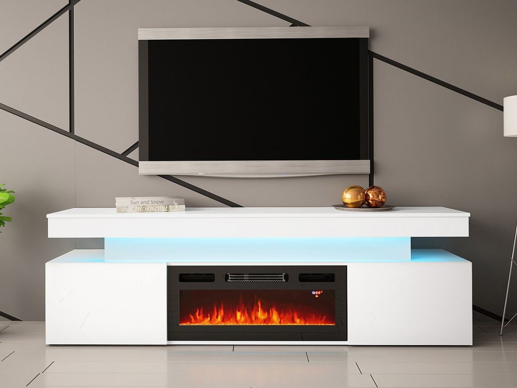 A modern white media console with a built-in electric fireplace is shown in a living room setting.