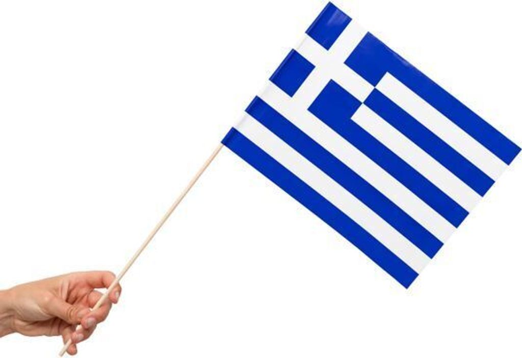 A hand holding a small flag of Greece on a white background.