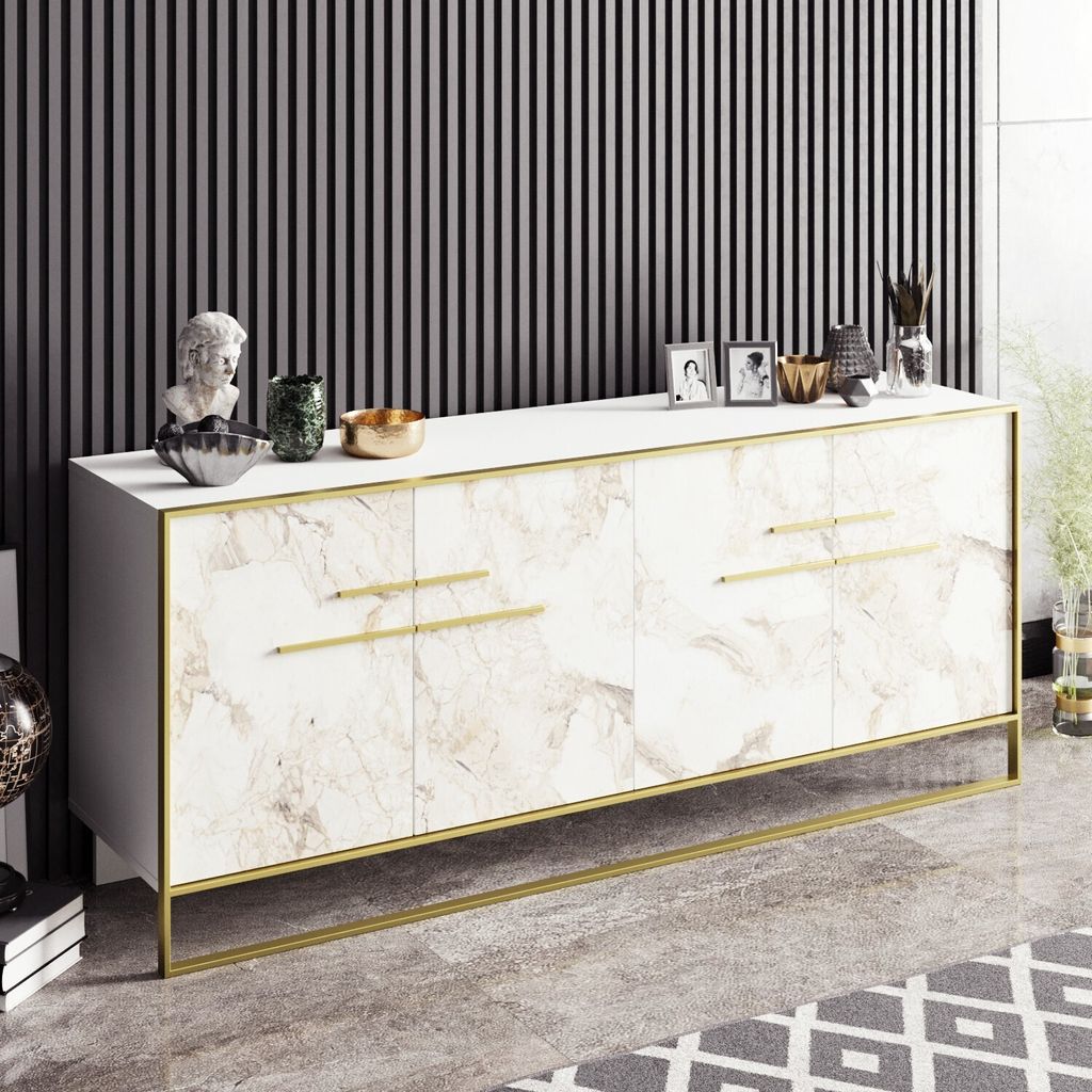 A white sideboard with a marble-like finish and gold accents, set against a black and white striped wall.