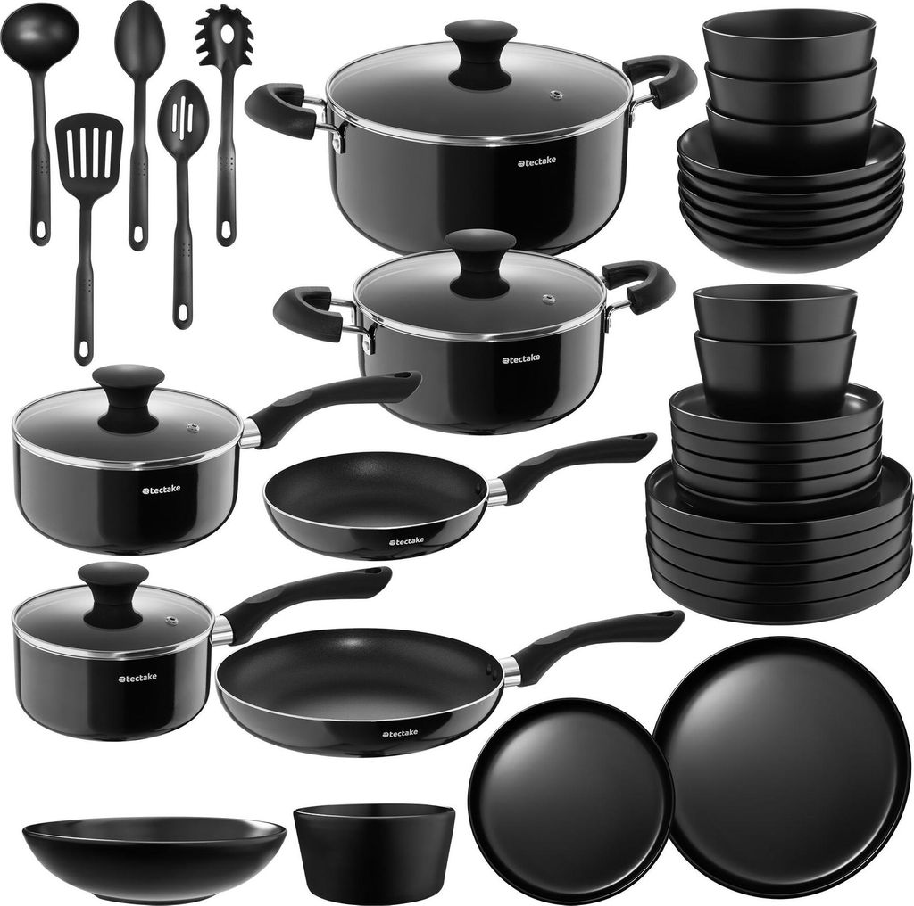 A collection of black cookware and kitchen utensils arranged on a white background.