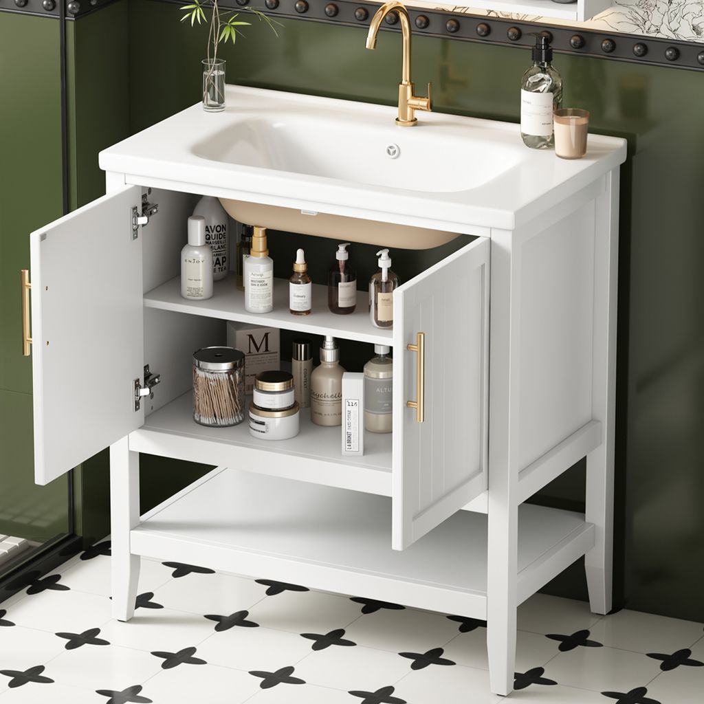 A white bathroom vanity with open doors and shelves, displaying various toiletries and cleaning products. A gold faucet is visible on the white sink.