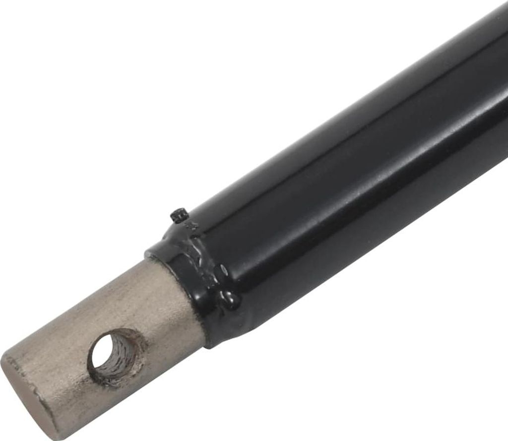 A close-up view of the end of a black metal drill extension with a silver metal attachment point with a hole.