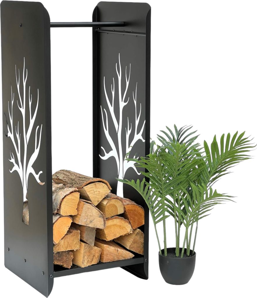 A black metal firewood rack with a tree silhouette design, filled with logs, stands next to a potted green plant.