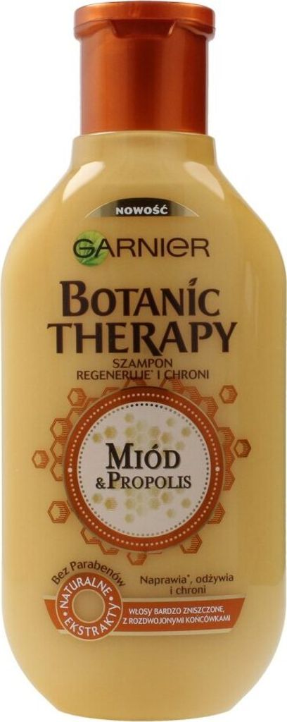 A bottle of Garnier Botanic Therapy shampoo with honey and propolis.