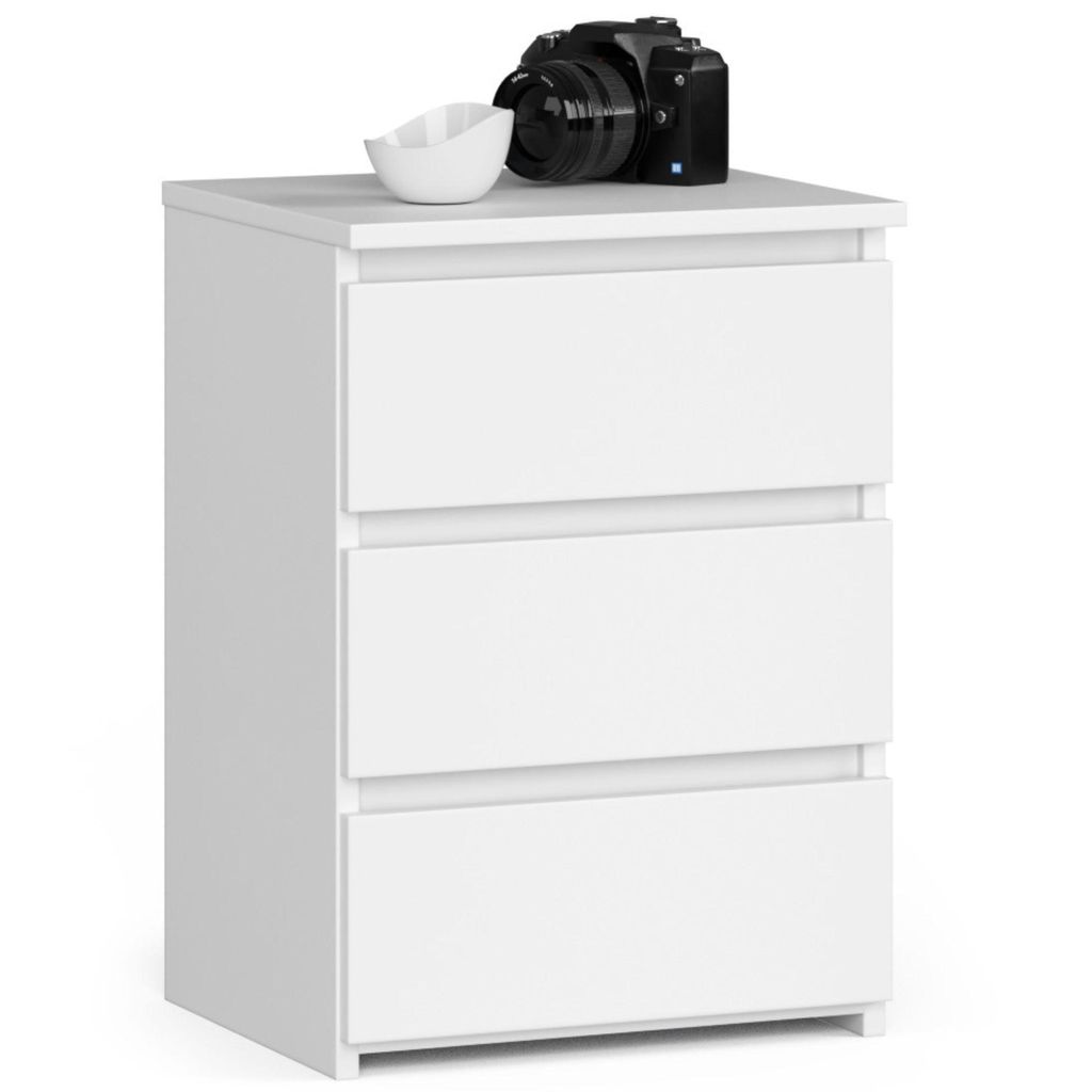 A white three-drawer nightstand with a camera and a small bowl on top.