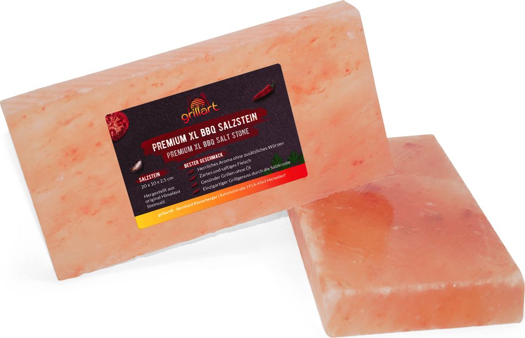 Two rectangular pink salt stones are shown on a white background. One stone is in the foreground, and the other is behind it and slightly to the left. A label is attached to the stone in the background.