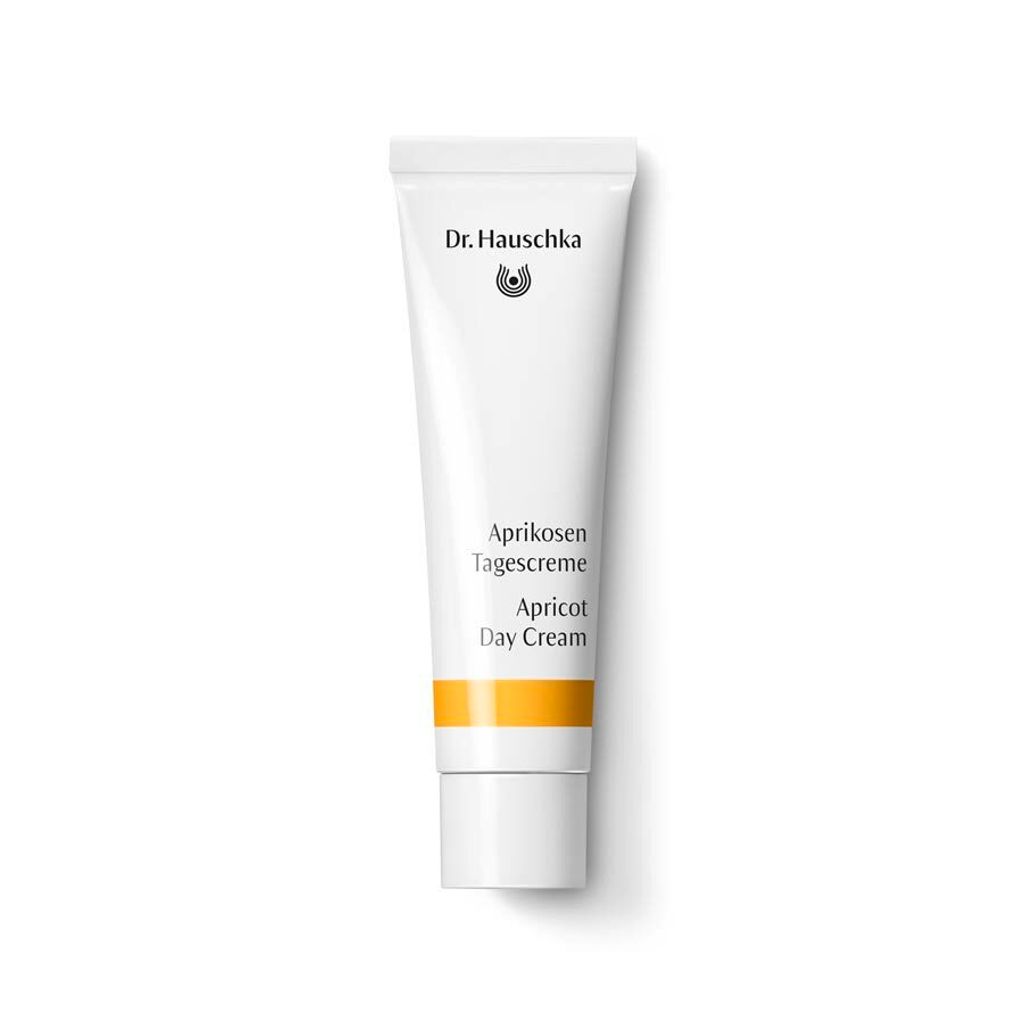 A product shot of a tube of Dr. Hauschka Apricot Day Cream against a white background.