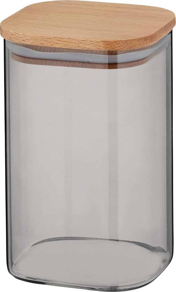 A clear studio shot of a glass storage jar with a wooden lid.