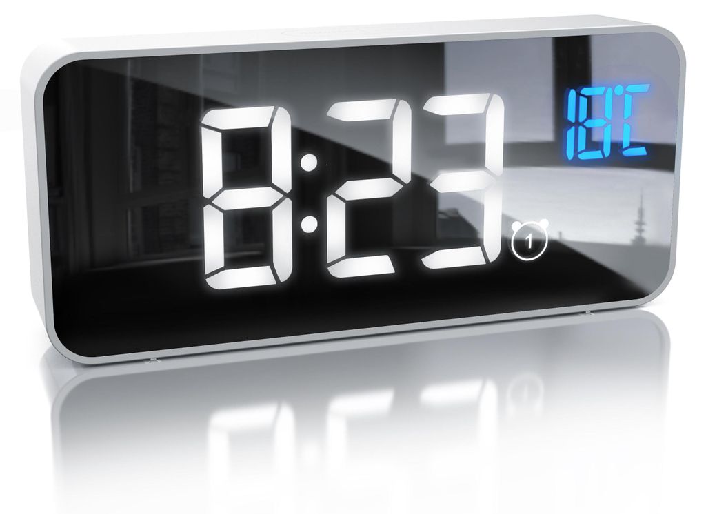 A digital alarm clock with a mirrored display showing the time and temperature.