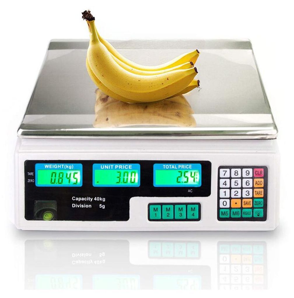 A digital scale with bananas on top, displaying weight, unit price, and total price.
