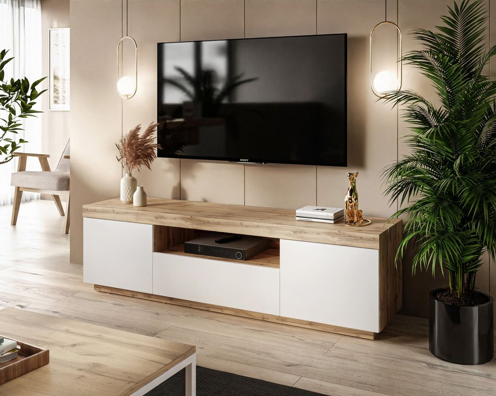 A modern living room with a TV stand and television.