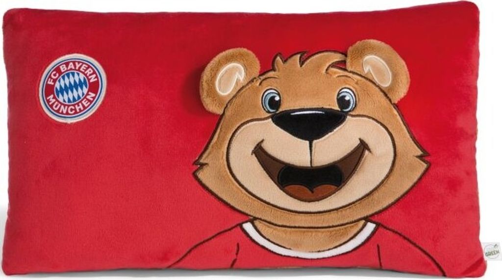 A red pillow with a cartoon bear character and the FC Bayern München logo.