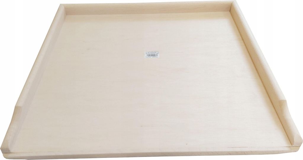 A flat, light-colored wooden board with raised edges, likely a pastry board or similar kitchen tool.