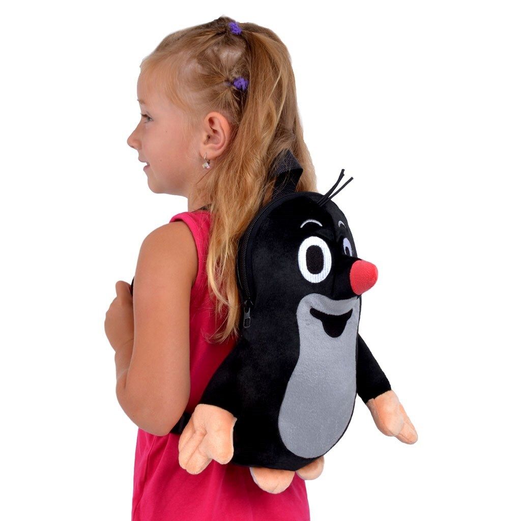 A young girl wearing a pink shirt is shown from the side, wearing a plush mole backpack.