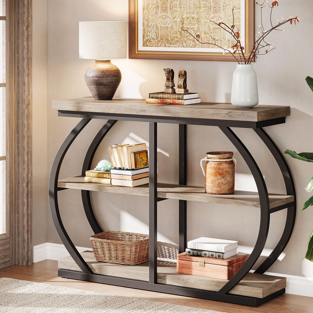 A console table with decorative items on it, placed in a room setting.
