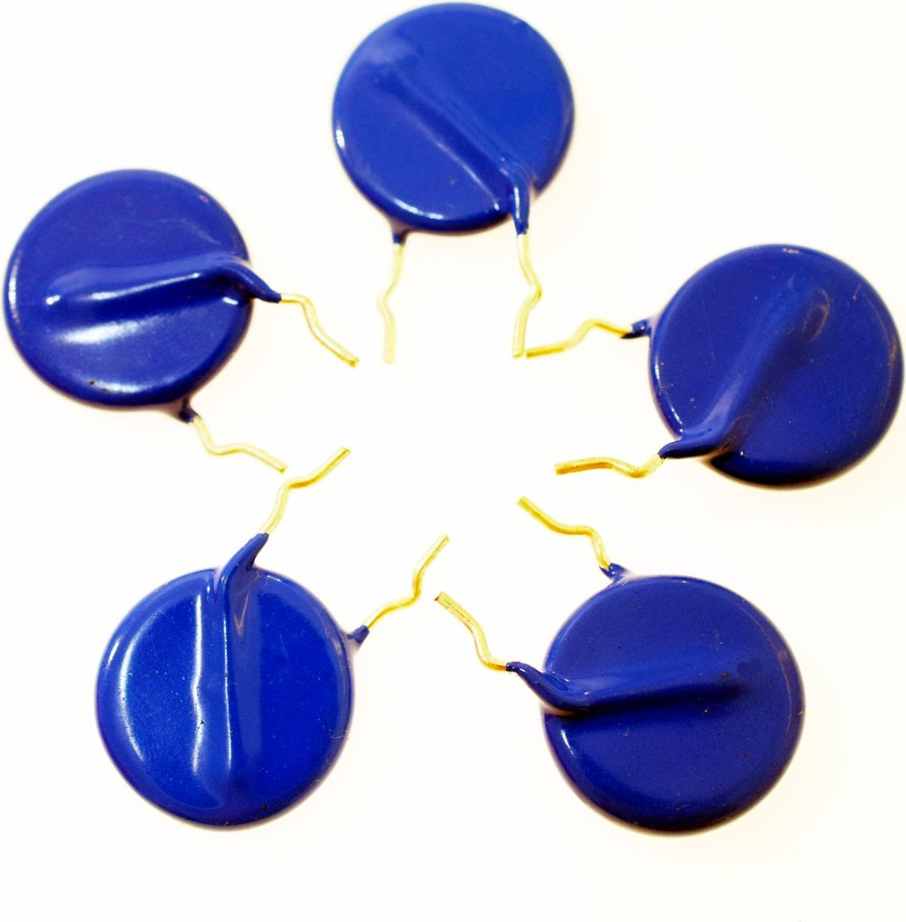 Five blue electronic components with gold leads arranged in a star shape on a white background.
