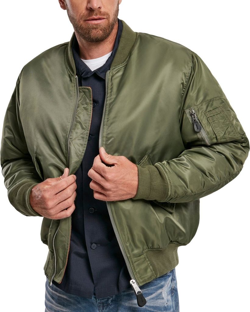 A man wearing a green bomber jacket.