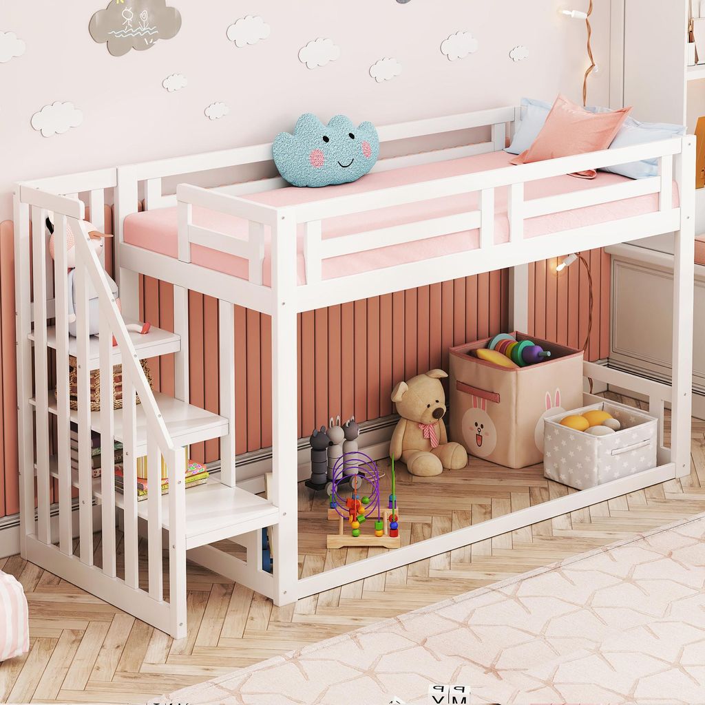 A child's bedroom with a white loft bed, pink bedding, and various toys and decorations.