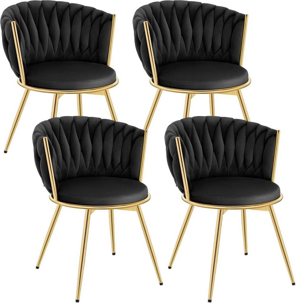 Four black velvet chairs with gold metal legs are arranged in a grid against a white background.