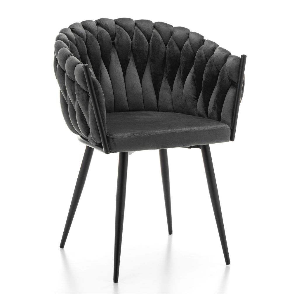 A gray velvet chair with black legs against a white background.