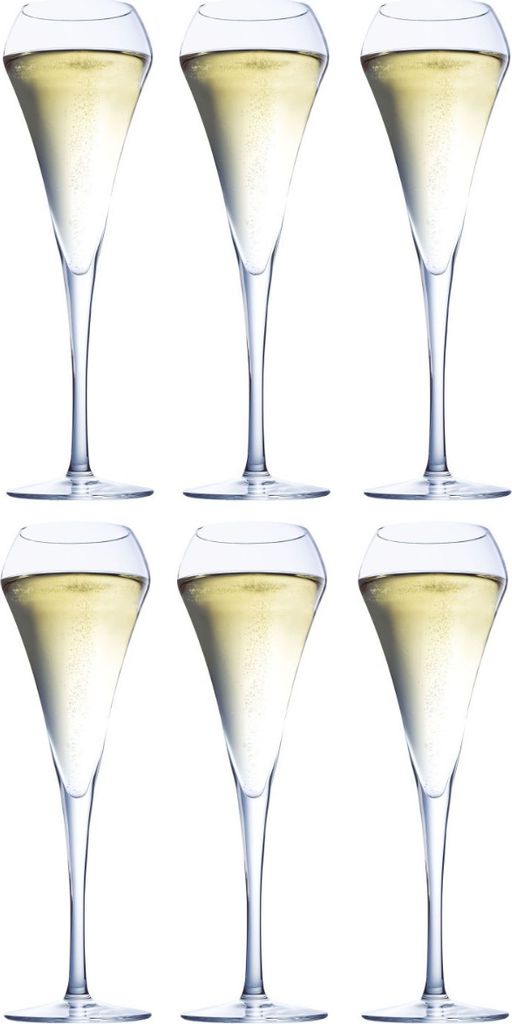 Six champagne flutes filled with a pale yellow liquid, arranged in two rows of three.