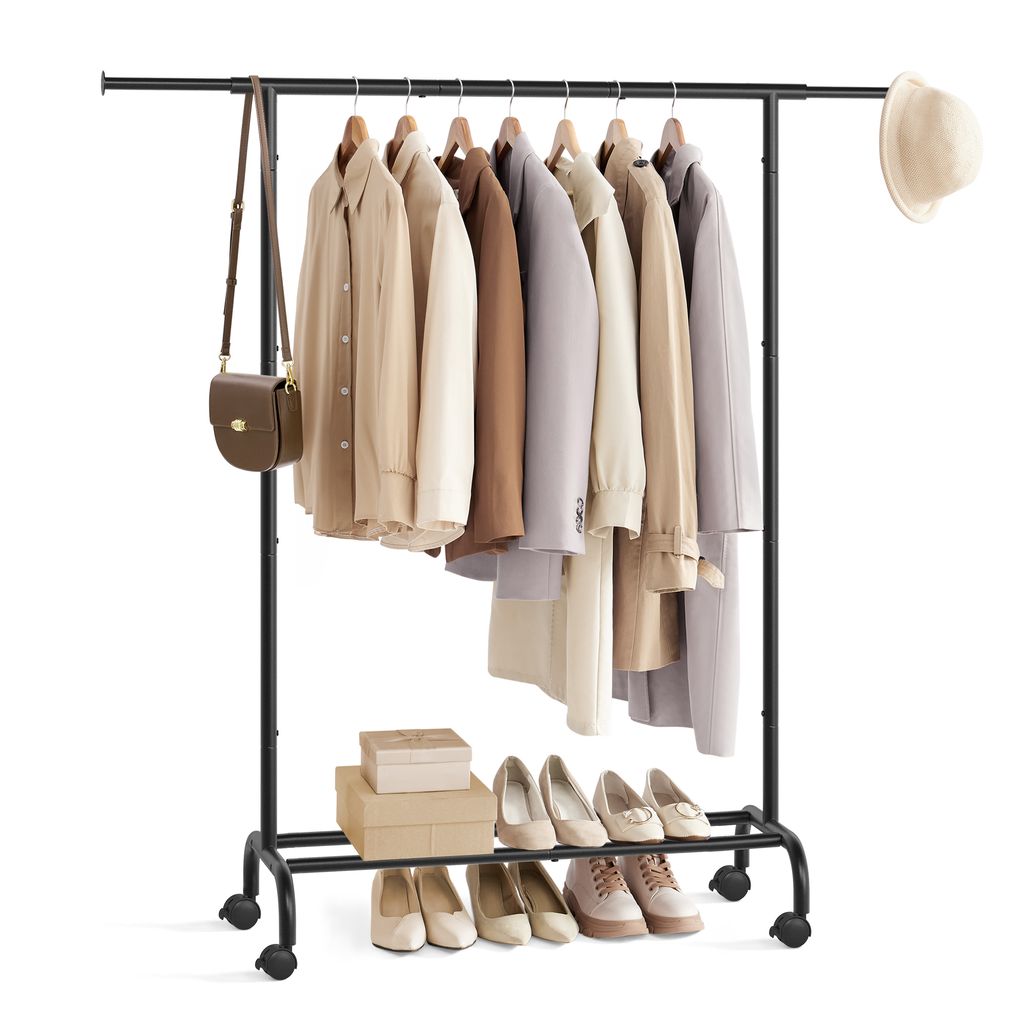 A clothing rack with clothes and shoes on display, with a handbag and hat as accessories.