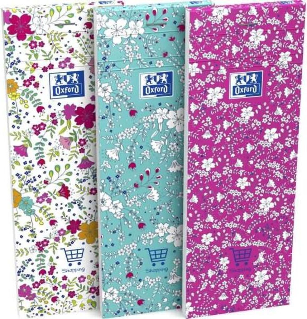 Three floral patterned notebooks standing upright.