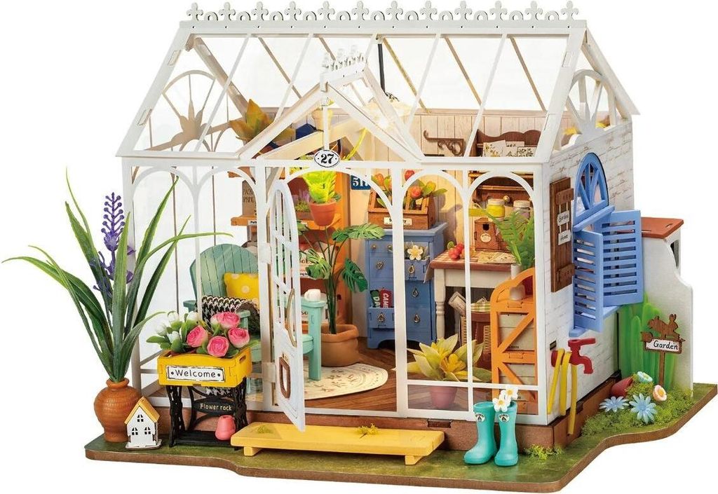 A miniature greenhouse model with detailed interior furnishings and plants.