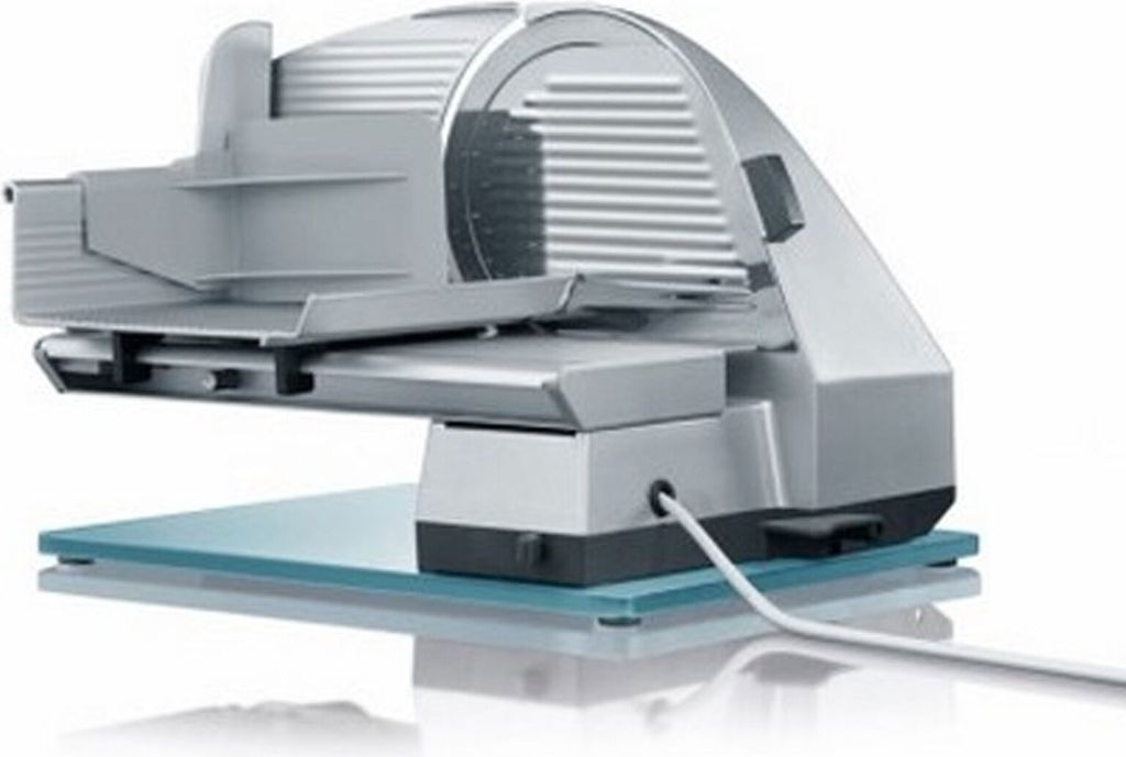 A silver and gray electric food slicer is shown on a light blue glass base against a white background.