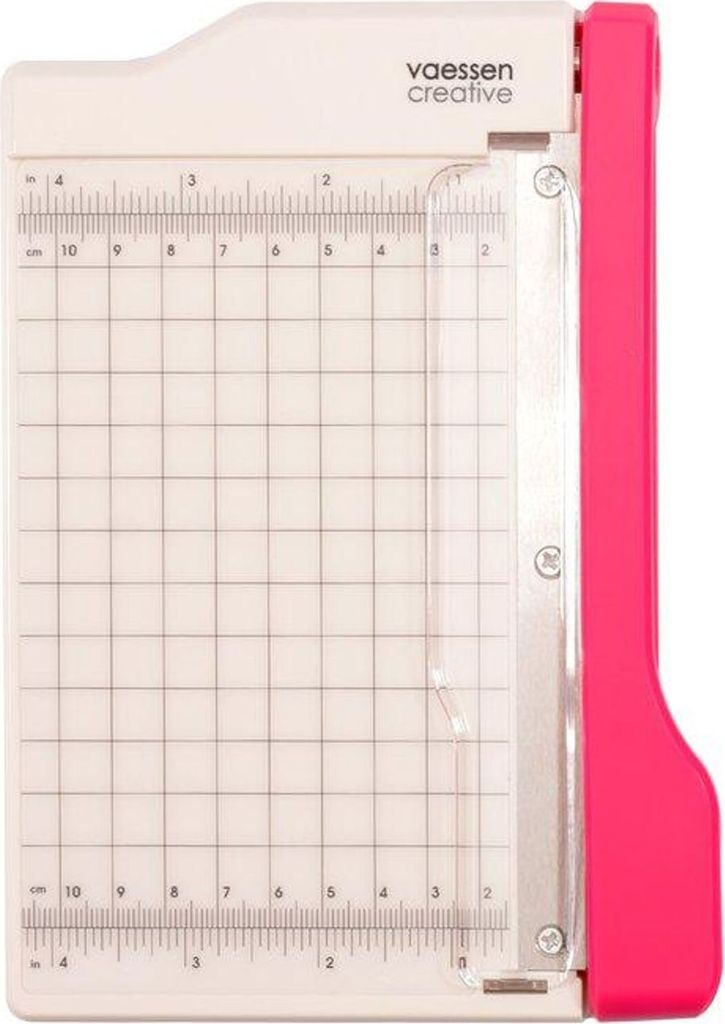 A top-down view of a pink and white paper guillotine trimmer.