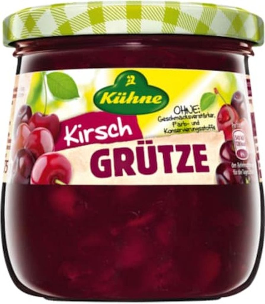 A jar of Kühne Kirsch Grütze with cherries visible inside and on the label.