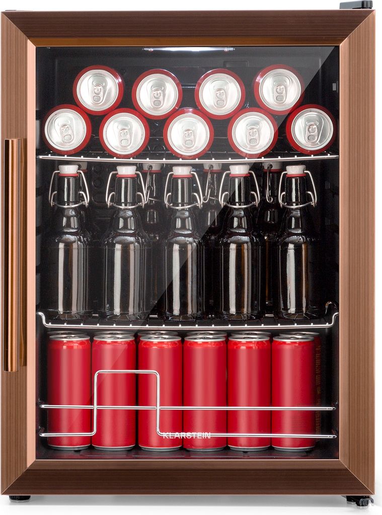 A small beverage cooler filled with red cans and glass bottles.