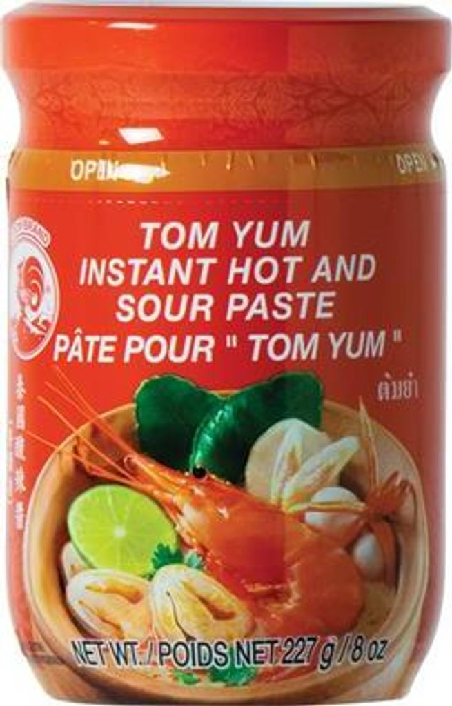 A jar of Tom Yum instant hot and sour paste with an illustration of the dish on the label.